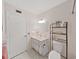 Bathroom with vanity, toilet and a door to the shower at 2221 Swedish Dr # 15, Clearwater, FL 33763