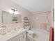 Bathroom featuring vanity, toilet and shower-tub combo with accessories at 2221 Swedish Dr # 15, Clearwater, FL 33763
