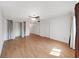 Spacious bedroom features hardwood floors, closet, and ceiling fan with light at 2221 Swedish Dr # 15, Clearwater, FL 33763