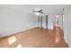 Bright bedroom features hardwood floors, a ceiling fan, and closet with sliding doors at 2221 Swedish Dr # 15, Clearwater, FL 33763