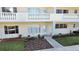 Charming condo with well-maintained landscaping, trimmed bushes, and a quaint entryway at 2221 Swedish Dr # 15, Clearwater, FL 33763