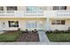 Inviting condo exterior features manicured landscaping, natural light and covered balcony at 2221 Swedish Dr # 15, Clearwater, FL 33763