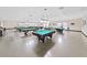 Large game room featuring multiple billiard tables and ample lighting at 2221 Swedish Dr # 15, Clearwater, FL 33763