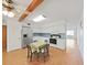Bright kitchen with stainless steel refrigerator, white cabinets, blue countertops and eat in dining at 2221 Swedish Dr # 15, Clearwater, FL 33763
