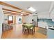Open floor plan with eat-in kitchen, living area, exposed beams, and plenty of natural light at 2221 Swedish Dr # 15, Clearwater, FL 33763