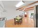 Bright living space with exposed wood beams flowing from eat-in kitchen with wood floors and plenty of light at 2221 Swedish Dr # 15, Clearwater, FL 33763