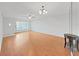 Inviting living room with hardwood floors, natural light, ceiling fan, and neutral paint at 2221 Swedish Dr # 15, Clearwater, FL 33763