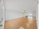 Spacious living room featuring hardwood floors, ample natural light, and neutral paint scheme at 2221 Swedish Dr # 15, Clearwater, FL 33763