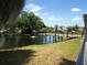 Water feature view with a lovely pond and walk bridge at 2221 Swedish Dr # 15, Clearwater, FL 33763
