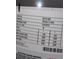 Close up image of a water heater specifications tag that shows the serial and model numbers, and wattage numbers at 2221 Swedish Dr # 15, Clearwater, FL 33763