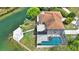 Home featuring a screened-in pool, spacious deck, and canal access with a private dock at 3415 Holly Springs Dr, Hernando Beach, FL 34607