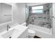 Bright bathroom featuring a shower-tub combination, a new vanity, and neutral tones at 3415 Holly Springs Dr, Hernando Beach, FL 34607