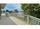 Deck offers scenic views of the canal, lush trees, tropical foliage, and blue water at 3415 Holly Springs Dr, Hernando Beach, FL 34607