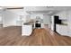 Open kitchen with granite countertops, stainless appliances, and updated white cabinetry at 3415 Holly Springs Dr, Hernando Beach, FL 34607