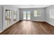 Expansive living space with laminate floors and natural light, creating a cozy atmosphere at 3415 Holly Springs Dr, Hernando Beach, FL 34607