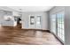 Spacious living room with laminate flooring, and kitchen view, perfect for entertaining at 3415 Holly Springs Dr, Hernando Beach, FL 34607