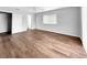 Spacious main bedroom featuring updated floors, ceiling fan, closet, and bathroom access at 3415 Holly Springs Dr, Hernando Beach, FL 34607
