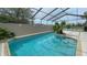 Inviting pool featuring a screened enclosure for year-round enjoyment and clear water at 3415 Holly Springs Dr, Hernando Beach, FL 34607