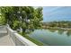 Scenic view of the canal from the outdoor deck featuring lush greenery and calm water at 3415 Holly Springs Dr, Hernando Beach, FL 34607