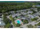 Aerial view of community featuring lush landscaping, a pool, and well-maintained buildings at 4217 Terrapin Pl # 4217, New Port Richey, FL 34652
