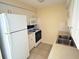 Compact kitchen is equipped with modern appliances and sufficient storage at 4217 Terrapin Pl # 4217, New Port Richey, FL 34652