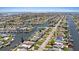Aerial shot of a canal community, highlighting street address and waterway access for waterfront homes at 4400 Floramar Ter, New Port Richey, FL 34652