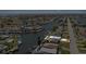 Aerial view of waterfront property with private boat dock and caged pool at 4400 Floramar Ter, New Port Richey, FL 34652