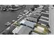 Overhead view of waterfront homes with a screened pool, boats and docks in a black and white canal neighborhood at 4400 Floramar Ter, New Port Richey, FL 34652