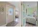 Inviting foyer with tile flooring leads to a cozy bedroom and a comfortably furnished living room at 4400 Floramar Ter, New Port Richey, FL 34652