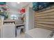 Well-organized laundry room with washer, dryer, and ample storage space at 4400 Floramar Ter, New Port Richey, FL 34652
