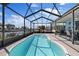 Enclosed lanai features a plunge pool, seating, and waterfront views at 4400 Floramar Ter, New Port Richey, FL 34652