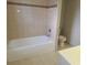 Bathroom features tiled walls, tub, toilet, and vanity at 4503 Sheffield Rd, Land O Lakes, FL 34639