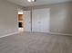 Spacious bedroom features plush carpeting and a ceiling fan at 4503 Sheffield Rd, Land O Lakes, FL 34639