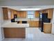 Spacious kitchen with oak cabinets, black appliances, and a skylight, offering plenty of counter space at 4503 Sheffield Rd, Land O Lakes, FL 34639
