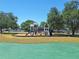 Community playground with swings and slides is centrally located in grassy open space at 4503 Sheffield Rd, Land O Lakes, FL 34639