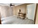 An adaptable room featuring light wood paneling, neutral wall paint, and a ceiling fan at 4548 Somerset Pl, New Port Richey, FL 34652