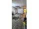 Uncluttered garage with abundant space, providing versatile options for parking and storage at 4548 Somerset Pl, New Port Richey, FL 34652