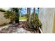 Beautiful landscaping alongside the home with lovely plants and stone work at 4548 Somerset Pl, New Port Richey, FL 34652