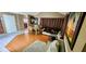 Bright living area with hardwood floors, neutral walls and dining area with a table and chairs at 4548 Somerset Pl, New Port Richey, FL 34652