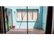 Covered patio perfect for outdoor lounging and with glass doors and a light blue exterior at 4548 Somerset Pl, New Port Richey, FL 34652