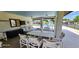 Relaxing pool area with covered seating and tables for residents to enjoy at 4548 Somerset Pl, New Port Richey, FL 34652