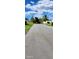 Street view looking down the main road of the community at 4548 Somerset Pl, New Port Richey, FL 34652
