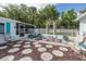 Features backyard patio with stepping stones, chairs and outdoor decorations at 4573 Ontario Dr, New Port Richey, FL 34652