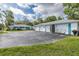 Wide driveway leads to a multi-car garage, providing plenty of parking for vehicles at 4573 Ontario Dr, New Port Richey, FL 34652