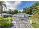 Long driveway leading to a three-car garage, offering ample parking space for residents and guests at 4573 Ontario Dr, New Port Richey, FL 34652