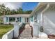 Charming single-story home featuring a stone exterior and a welcoming brick walkway leading to the front door at 4573 Ontario Dr, New Port Richey, FL 34652