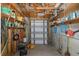 Well-organized garage space with ample storage, shelves, and tools for home maintenance and projects at 4573 Ontario Dr, New Port Richey, FL 34652