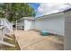 The image showcases a garage with a clean driveway and outdoor seating at 4573 Ontario Dr, New Port Richey, FL 34652