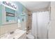 Nautical themed bathroom features tiled shower and tub combination with coordinated decor at 4731 Egret Rd, Venice, FL 34293