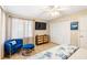 Bright bedroom features a TV, seating, and closet space at 4731 Egret Rd, Venice, FL 34293